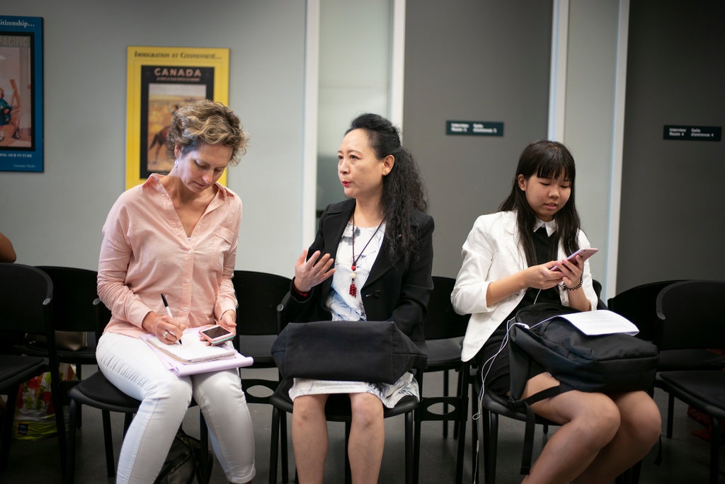 Catherine Porter interviews Sheng Xue as she helps an asylum seeker in Toronto.